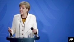 German Chancellor Angela Merkel gestures during a joint press conference with Prime Minister of Finland Alexander Stubb (not pictured), at the chancellery in Berlin, Germany, Sept. 29, 2014.