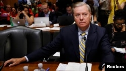 FILE - Senator Lindsey Graham sits before a Senate Finance Committee hearing on Capitol Hill in Washington, Sept. 25, 2017.