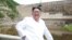 North Korean leader Kim Jong Un smiles during his visit to the under-construction Orangchon Power Station in this undated photo released by North Korea's Korean Central News Agency in Pyongyang, July 17, 2018. 