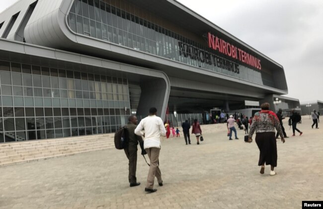 FILE - Passengers arrive to purchase tickets for the Standard Gauge Railway (SGR) line constructed by the China Road and Bridge Corporation (CRBC) and financed by Chinese government at the Nairobi Terminus in the outskirts Nairobi, Kenya, July 28, 2017.