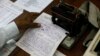 An Indian telegraph employee processes a telegram on the last day of the 163-year-old service at the central telegraph office in Mumbai, India,July 14, 2013. Sunday night, the state-run telecommunications company will send its final telegram, closing down