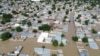 This aerial view shows houses submerged under water in Maiduguri on September 10, 2024.