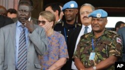 U.N. Mission in South Sudan (UNMISS) force commander Lt. Gen. Johnson Mogoa Kimani Ondieki of Kenya (R) stands next to Ellen Loj (C), Special Representative of the U.N. secretary-general, as they await a delegation of the U.N. Security Council, in Juba, South Sudan, Sept. 2, 2016.