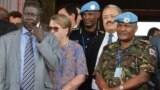 U.N. Mission in South Sudan (UNMISS) force commander Lt. Gen. Johnson Mogoa Kimani Ondieki of Kenya (R) stands next to Ellen Loj (C), Special Representative of the U.N. secretary-general, as they await a delegation of the U.N. Security Council, in Juba, South Sudan, Sept. 2, 2016.