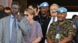 U.N. Mission in South Sudan (UNMISS) force commander Lt. Gen. Johnson Mogoa Kimani Ondieki of Kenya, right, stands next to Ellen Loj, center, Special Representative of the U.N. Secretary-General, as they await a delegation of U.N. Security Council members in Juba, South Sudan, Sept. 2, 2016.