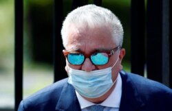 FILE - Belgium's Prince Laurent leaves after a celebration on Belgian national day, in Brussels, Belgium, July 21, 2020.