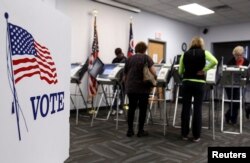 FILE - Ohioans make their choices known during early voting in the U.S. presidential election in Medina, Ohio, Oct. 26, 2012.