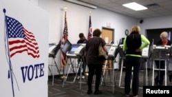 FILE - Some voters in Medina, Ohio, cast their ballots early, on Oct. 26, during the 2012 U.S. presidential election. Most U.S. states allow early voting.