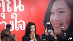 Yingluck Shinawatra, the opposition Pheu Thai Party's candidate for prime minister and youngest sister of ousted Prime Minister Thaksin Shinawatra, gestures as she attends a press conference at the party headquarters in Bangkok, Thailand, on Sunday, July 