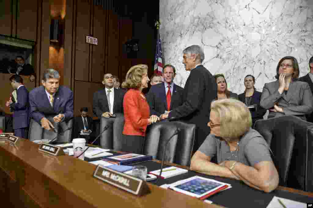 Members of the Senate Armed Services Committee gather to hear from Defense Secretary Chuck Hagel in Washington, Sept. 16, 2014.