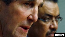 US Secretary of State John Kerry (foreground) speaks at a joint news conference with Ethiopian Foreign Minister Tedros Adhanom in Addis Ababa May 25, 2013.