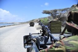 FILE - Soldiers patrol the seaport in Somalia's southern port city of Kismayo, November 29, 2012.