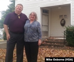 Pastor Dan Sweet and his wife, Joy, in front of Zion Hill United Methodist Church