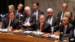 President Barack Obama speaks during a United Nations Security Council meeting, as United Kingdom Prime Minister David Cameron (L) and U.N. Secretary General Ban Ki-moon listen, at U.N. headquarters in New York, Sept. 24, 2014.