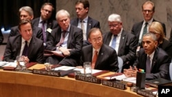 President Barack Obama speaks during a United Nations Security Council meeting, as United Kingdom Prime Minister David Cameron (L) and U.N. Secretary General Ban Ki-moon listen, at U.N. headquarters in New York, Sept. 24, 2014.