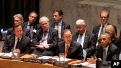 President Barack Obama speaks during a United Nations Security Council meeting, as United Kingdom Prime Minister David Cameron (L) and U.N. Secretary General Ban Ki-moon listen, at U.N. headquarters in New York, Sept. 24, 2014.