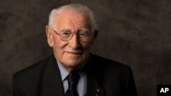 In this undated photo provided by the Sydney Jewish Museum, Holocaust survivor Eddie Jaku poses for a photograph in Sydney, Australia. 