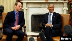 U.S. President Barack Obama, right, meets Britain's Prince William in the Oval Office of the White House in Washington, Dec. 8, 2014. 