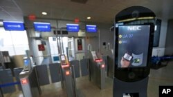 A U.S. Customs and Border Protection facial recognition device is shown at a United Airlines gate, Wednesday, July 12, 2017, at George Bush Intercontinental Airport, in Houston. (AP Photo/David J. Phillip)