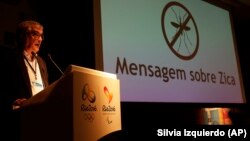 Mario Andrada, spokesperson for the Rio Olympic Organizing Committee, speaks next to a screen that reads in Portuguese : "Message about Zika" during a media briefing in Rio de Janeiro, Brazil, Tuesday, Feb. 2, 2016. 