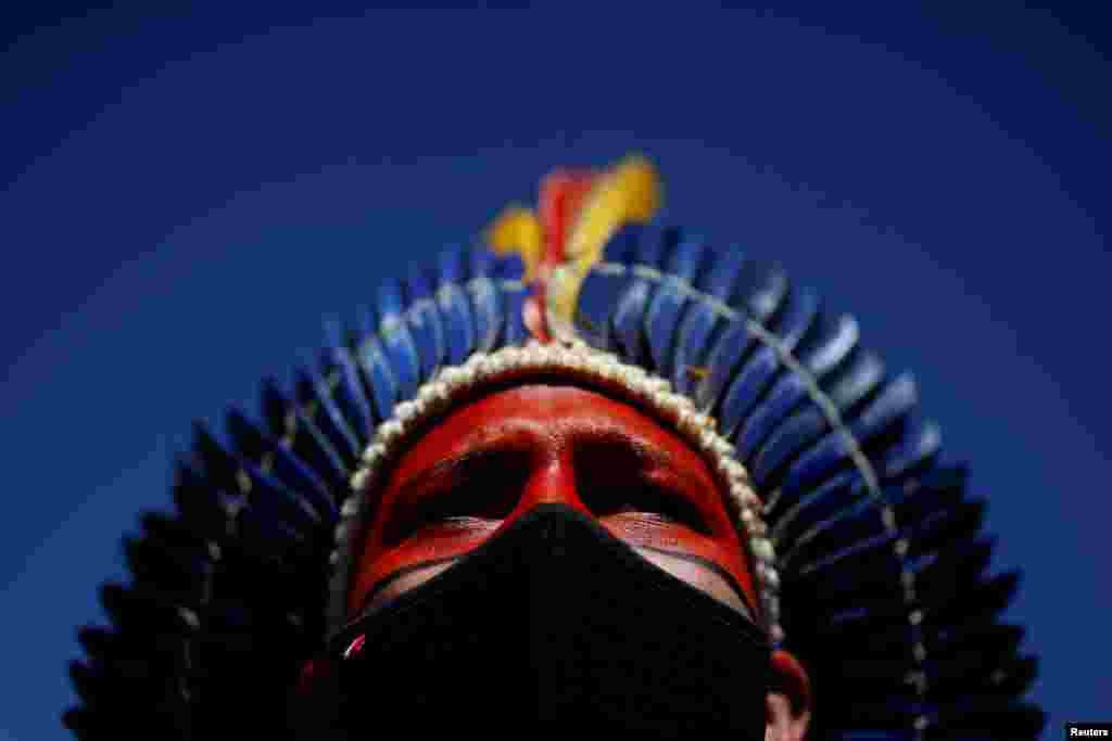 Davi Tupiniquin of the Tupiniquin tribe looks on during a protest for land marking and against President Jair Bolsonaro&#39;s government, next to the National Congress in Brasilia, Brazil.