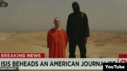 Potongan gambar video pemenggalan kepala jurnalis Amerika James Foley oleh anggota ISIS.