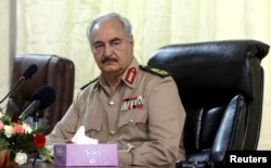 FILE - Libya's eastern-based commander Khalifa Haftar attends General Security conference, in Benghazi, Libya, Oct. 14, 2017.