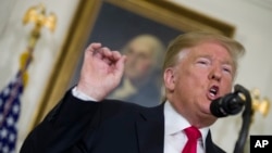 President Donald Trump speaks about the partial government shutdown, immigration and border security in the Diplomatic Reception Room of the White House, in Washington, Jan. 19, 2019.