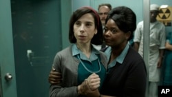 FILE - This image released by Fox Searchlight Pictures shows Sally Hawkins, left, and Octavia Spencer in a scene from "The Shape of Water." The movie premieres at the Toronto International Film Festival. 