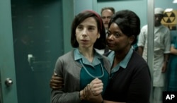 This image released by Fox Searchlight Pictures shows Sally Hawkins, left, and Octavia Spencer in a scene from "The Shape of Water." The movie premieres at the Toronto International Film Festival.