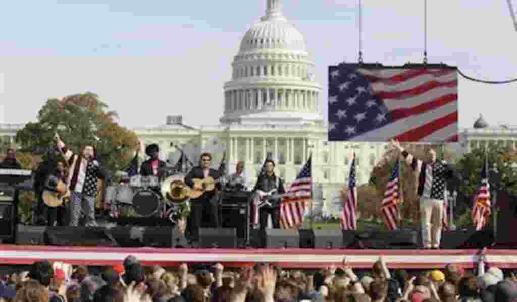 Comedians Jon Stewart, right, and Stephen Colbert, left, perform during their Rally to Restore Sanity and/or Fear on the National Mall in Washington, Saturday, Oct. 30, 2010.
