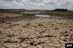 This photo shows the fast-drying catchment area of the Umzingwani dam in Matabeleland, southwestern Zimbabwe, Feb. 7, 2016. President Robert Mugabe had declared a state of disaster two days earlier in many rural areas hit by a severe drought.