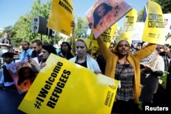 Protesters gather outside the White House for "NoMuslimBanEver" rally against what they say is discriminatory policies that unlawfully target American Muslim and immigrant communities, in Washington, Oct. 18, 2017.