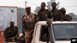 FILE - Chadian troops, part of an African Union peacekeeping force, drive down a road in Bangui, Central African Republic.