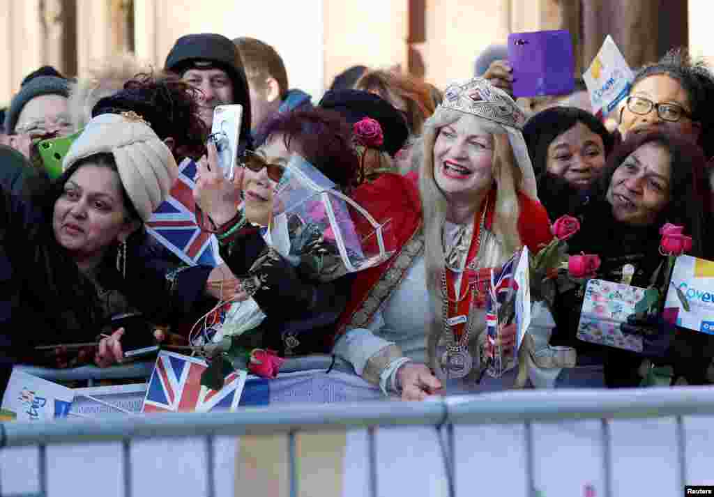 Well-wishers wait to greet Britain's Prince William and Catherine, the Duchess of Cambridge, as they make a visit to Coventry.