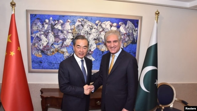 巴基斯坦总理依姆兰.汗2018年9月8日在伊斯兰堡会见中国国务委员兼外交部长王毅
