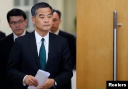 FILE - Hong Kong Chief Executive Leung Chun-ying arrives at a news conference.