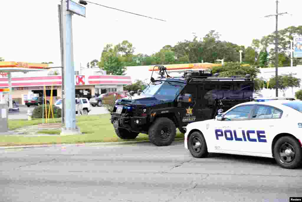 Police officers block off a road after a shooting of police in Baton Rouge, July 17, 2016.