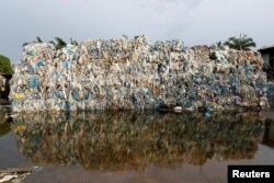 Plastic waste piled outside an illegal recycling factory in Jenjarom, Kuala Langat, Malaysia, Oct. 14, 2018.