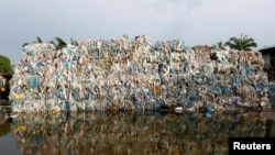 Plastic waste piled outside an illegal recycling factory in Jenjarom, Kuala Langat, Malaysia, Oct. 14, 2018.