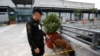 An airport police officer and a sniffer dog patrol Terminal 3 of the Ninoy Aquino International airport in Pasay City, Metro Manila, September 1, 2014.