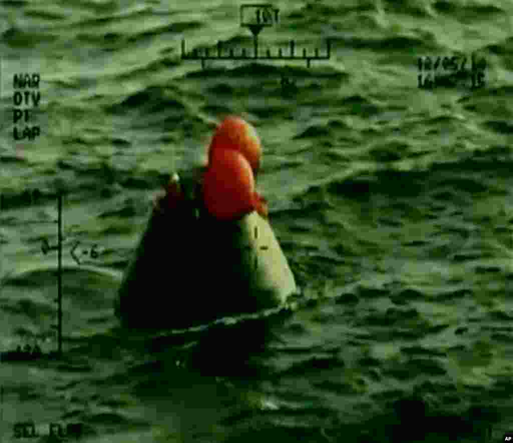 In this frame grab from NASA-TV, the Orion capsule floats after splashing down in the Pacific Ocean, Friday, Dec. 5, 2014.