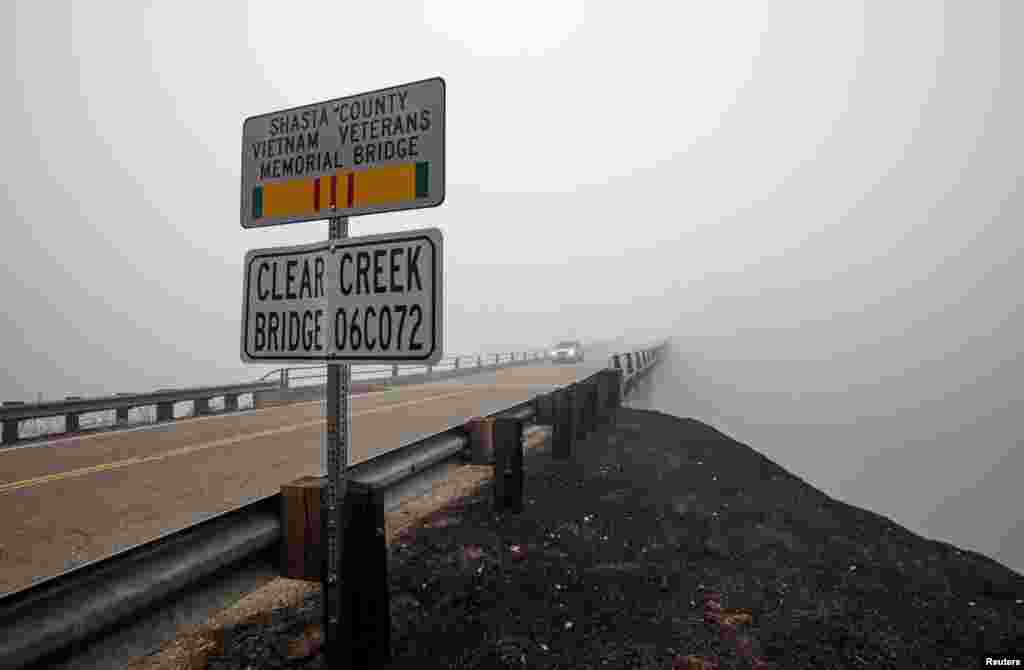 Smoke from the Carr Fire shrouds the Clear Creek Bridge near Igo, California, July 29, 2018.