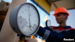 FILE - A pressure gauge is seen at a gas compressor station near Uzhhorod, western Ukraine, May 2014.