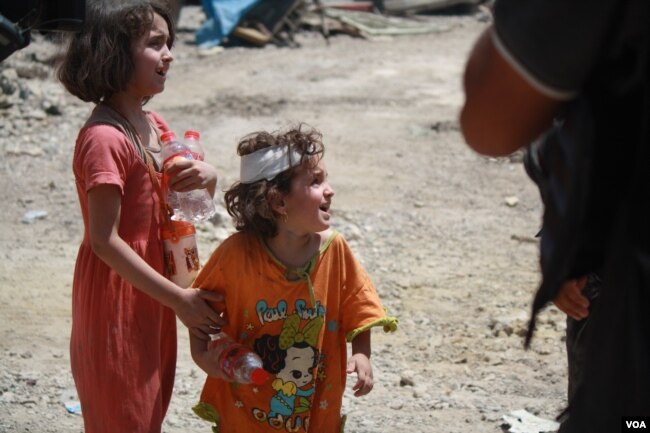 Islamic State's return in Tenek caused so much chaos and terror, that some parents lost track of their children. Here, children are pictured in Mosul, Iraq, July 2, 2017. (H. Murdock/VOA)