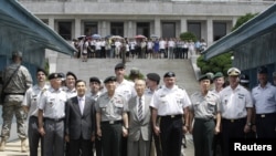 U.S. General James D. Thurman, commander of the U.S. Forces Korea (4th R), poses with the Neutral Nations Supervisory Commission, United Nations Forces and South Korean officers.