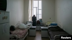 FILE - A patient is seen in a ward at the state-run Lavra clinic, Ukraine's main HIV treatment center, in Kyiv, Sept. 12, 2013. 