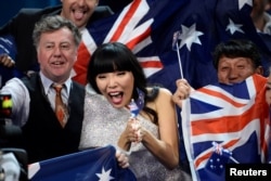 Australia's Dami Im cheers in the Green Room during the Eurovision Song Contest final at the Ericsson Globe Arena in Stockholm, Sweden, May 14, 2016.