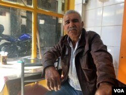 Many Turkish people, like Yashar, a Turkish fruit and vegetable seller in Izmir, are upset by the EU-Turkey plan, saying they don't understand how European countries could open the door for refugees, only later to slam it shut, April 6, 2016. (H. Murdock/VOA)