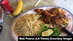 A traditional Somali meal of rice, lamb and banana (photo taken in Minneapolis, MN, by Matt Pearce)